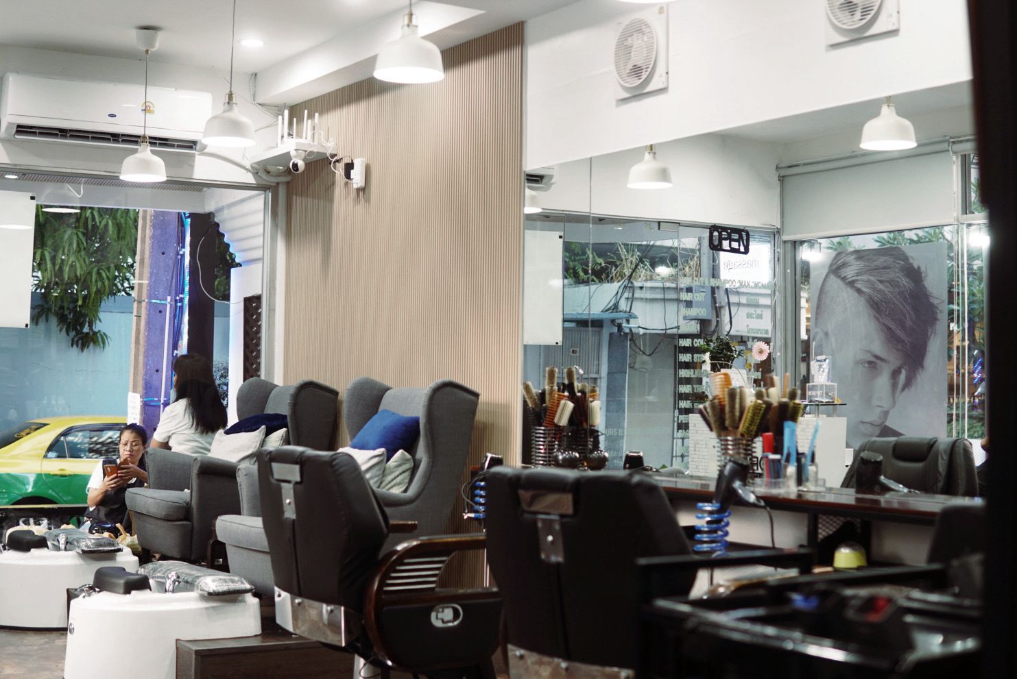 Modern salon interior with stylists at work