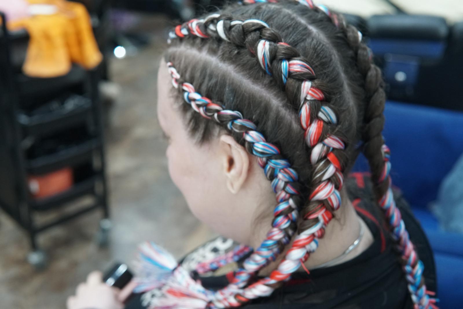 Detailed view of colored braided extensions